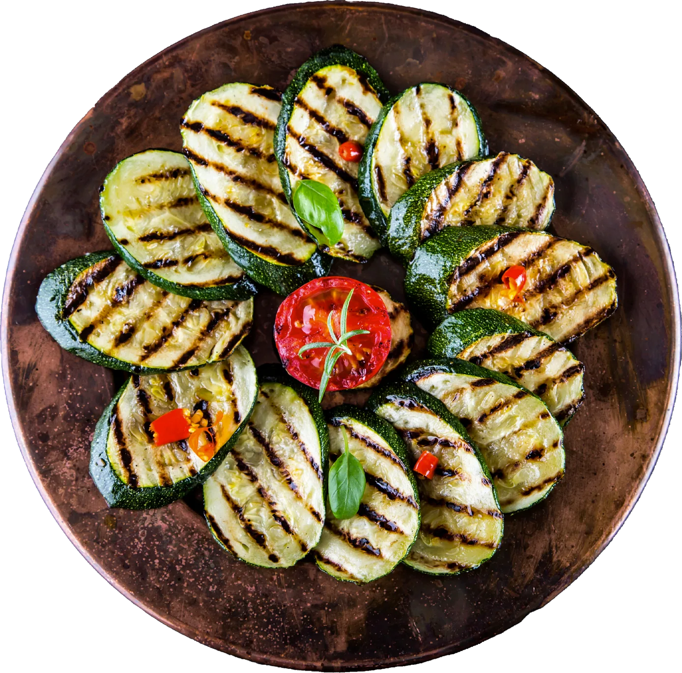 Gegrillte Zucchini auf einem Teller angerichtet.